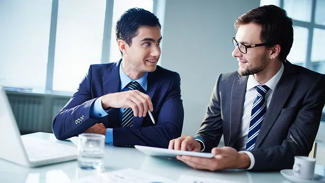 Two accountants discussing an account